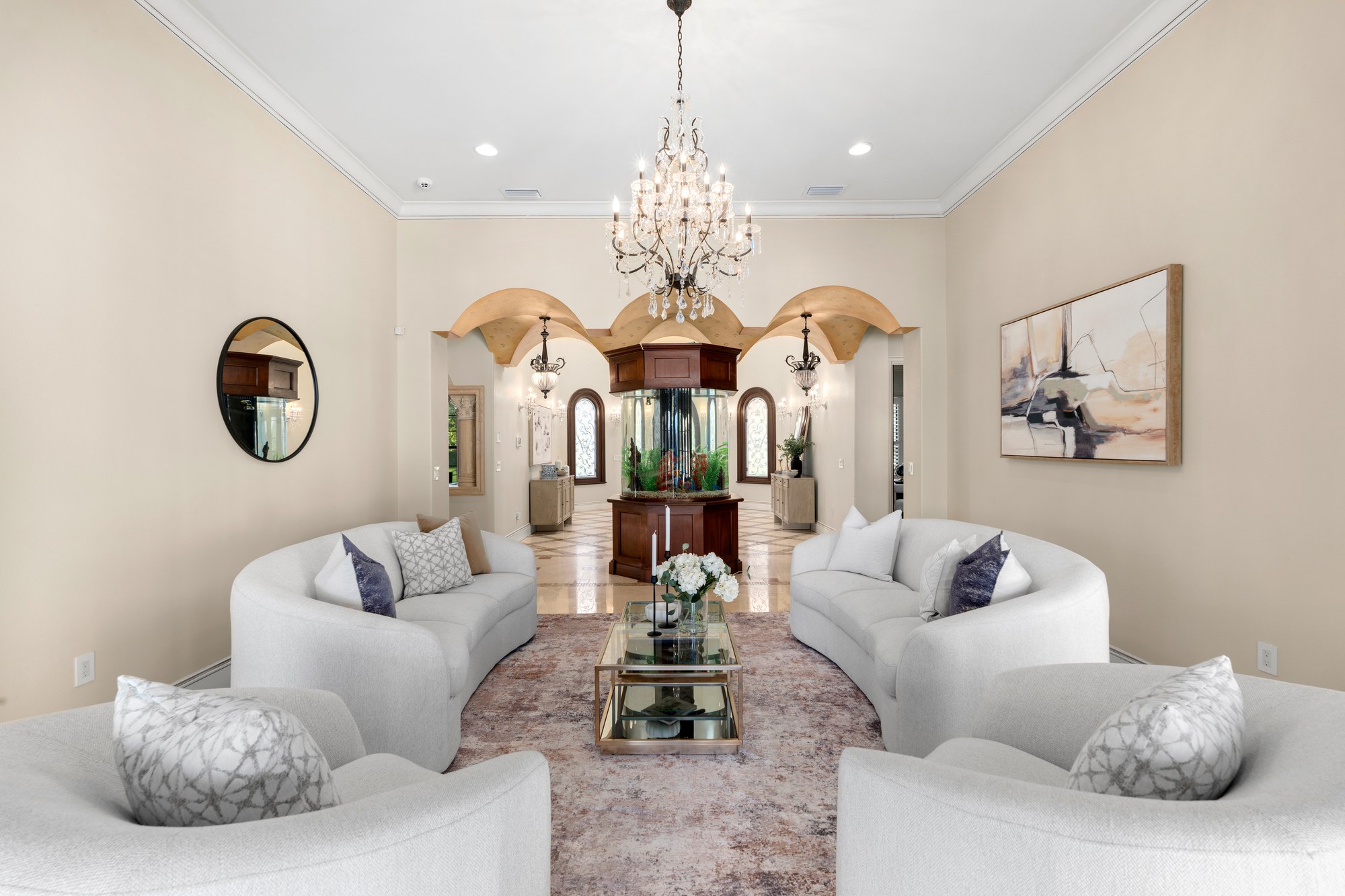 The formal living room, facing the foyer's custom aquarium