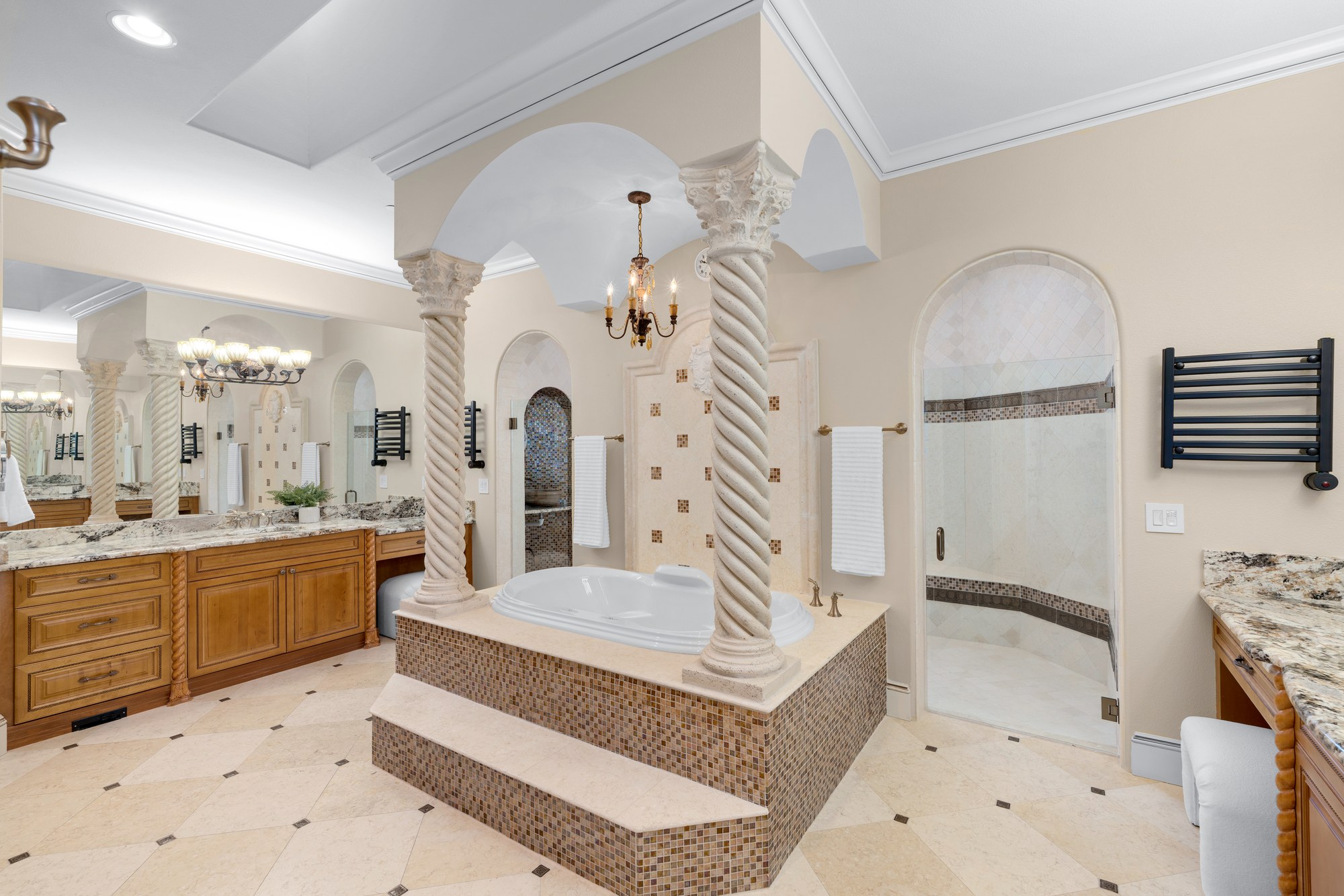 The primary bath's Roman soaking tub beneath a domed, columned alcove