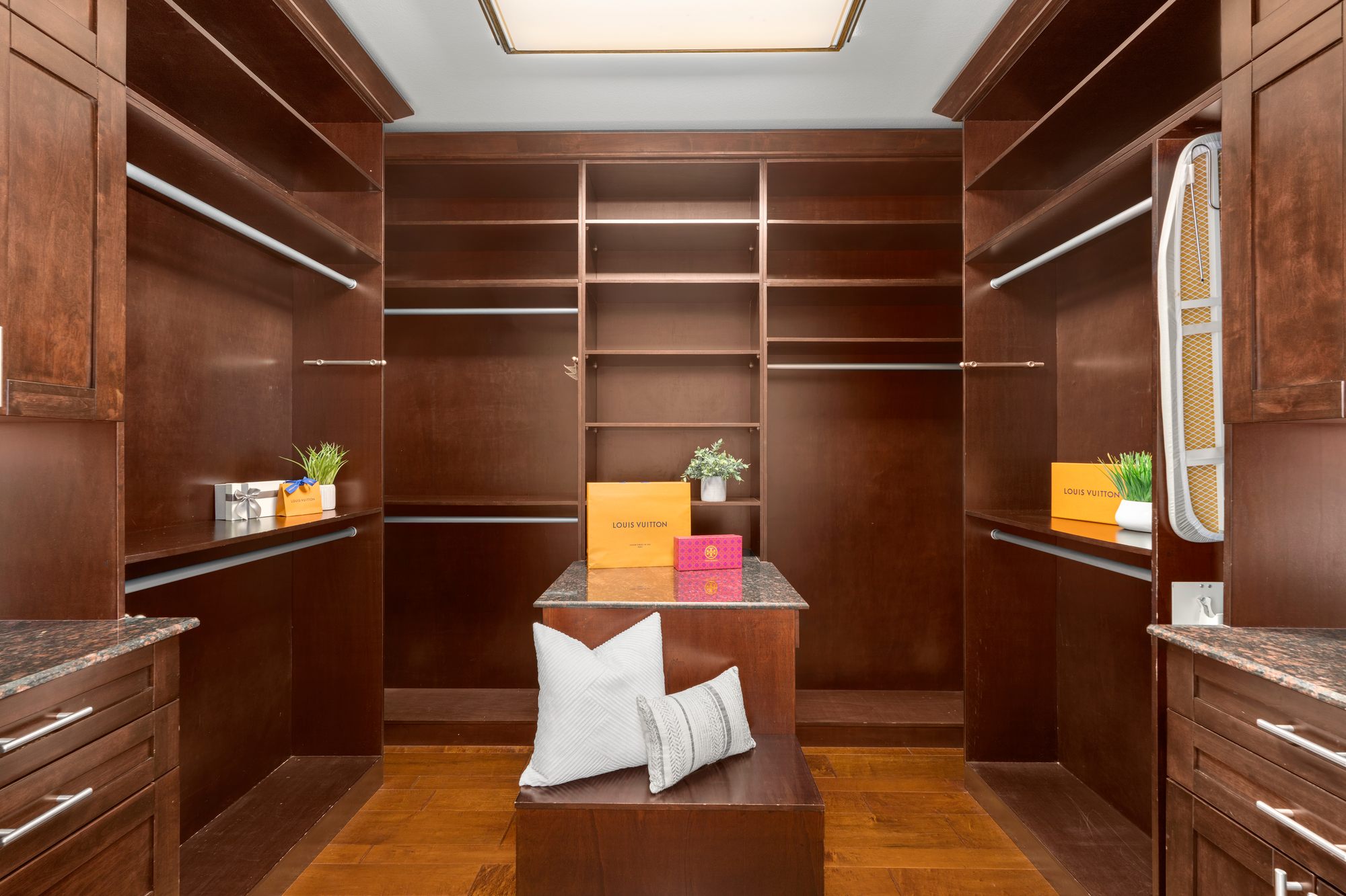 The boutique inspired primary dressing room with a center island