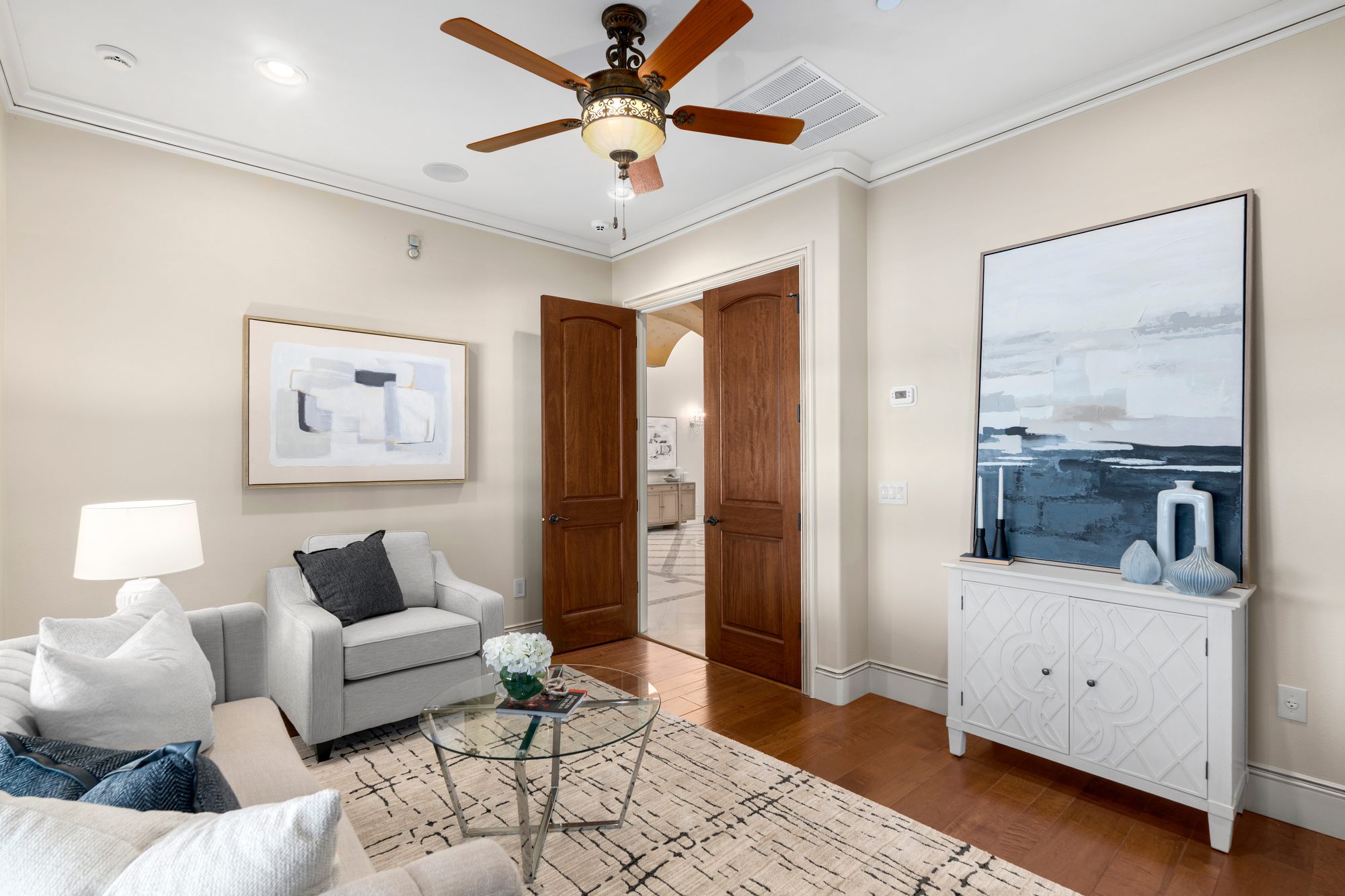 The sitting area leading into the primary suite